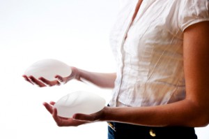 woman holding silicone implant, safety story las vegas