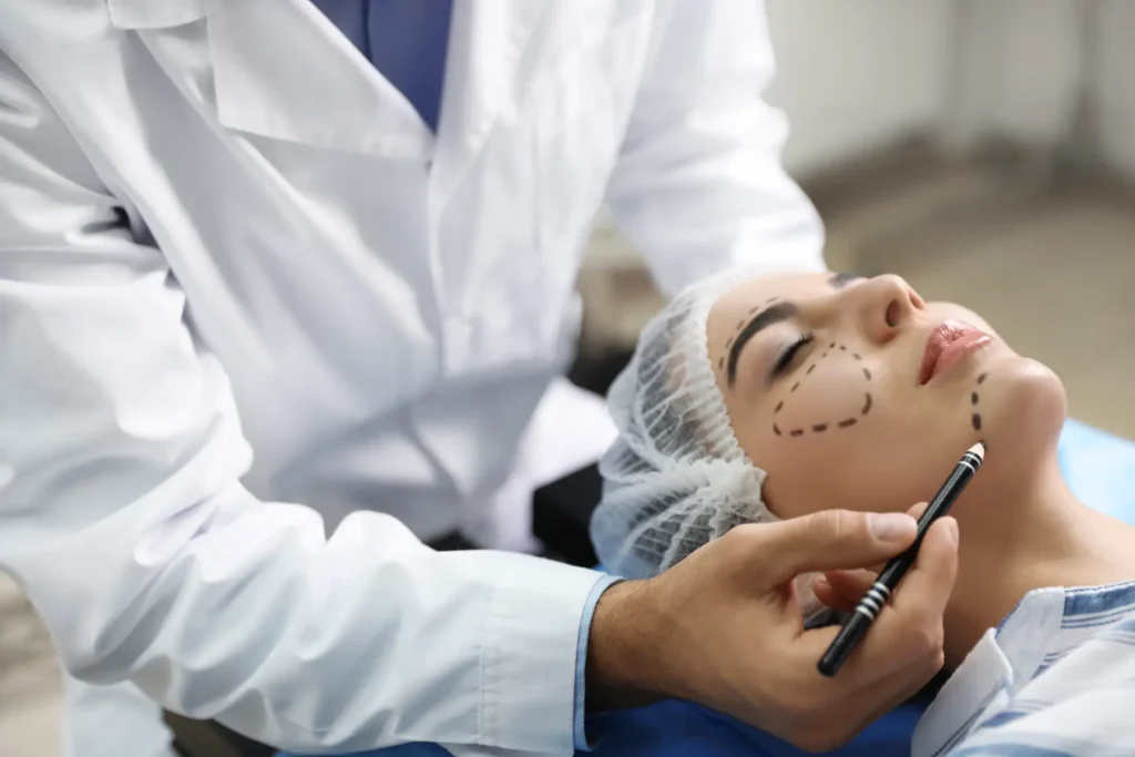 Patient lying down with facial markings during cosmetic procedure planning